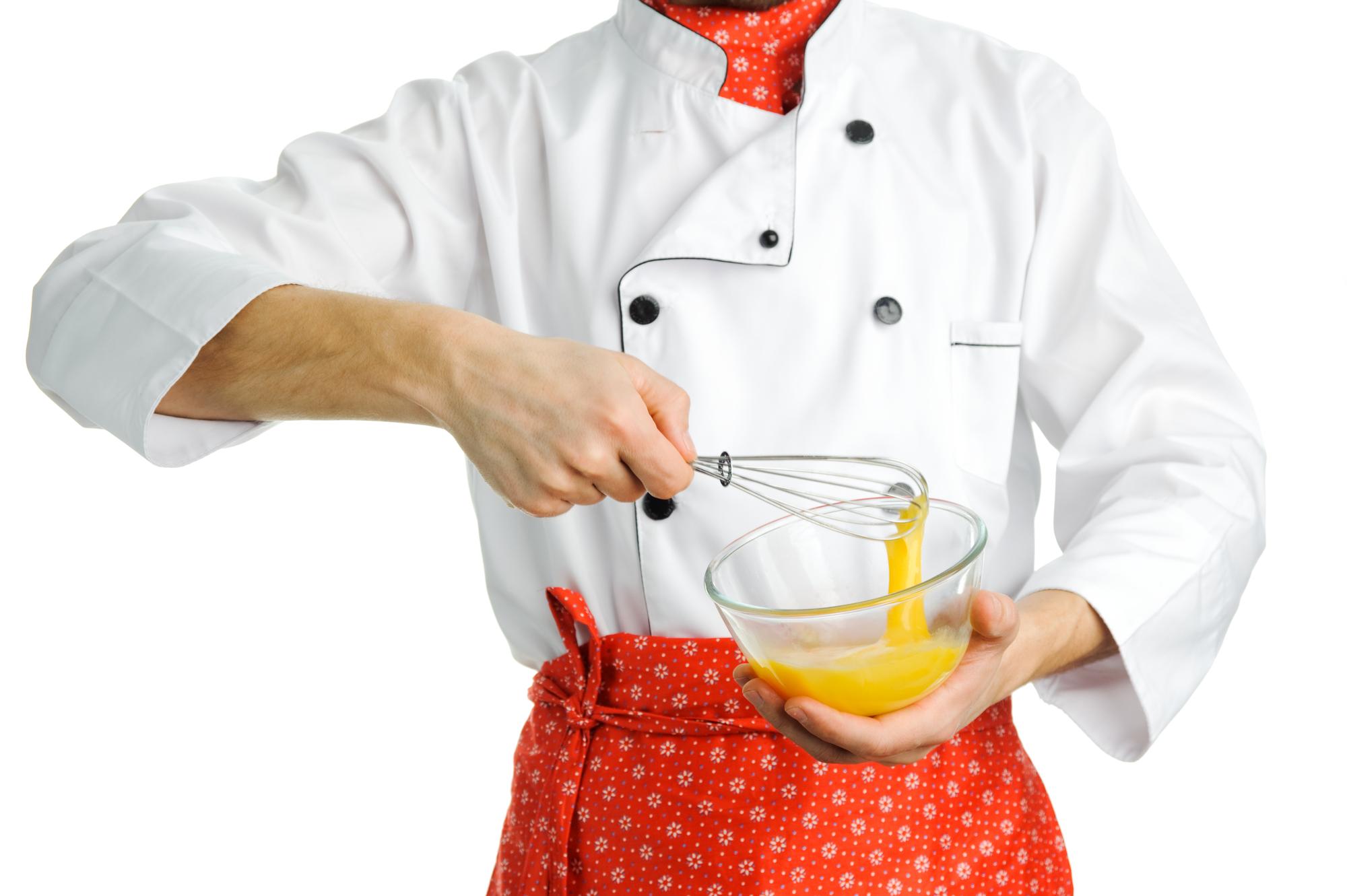 Hands plating a dish during class
